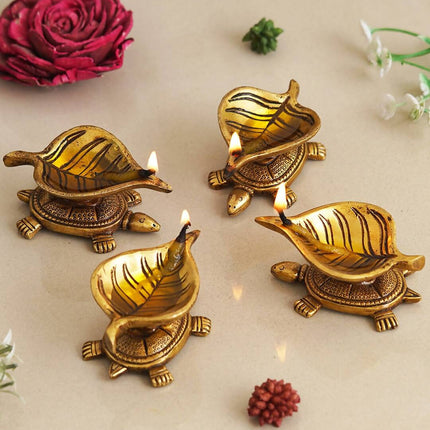 eCraftIndia 4 Pieces Beige Tortoise Statue Leaf Design Diyas