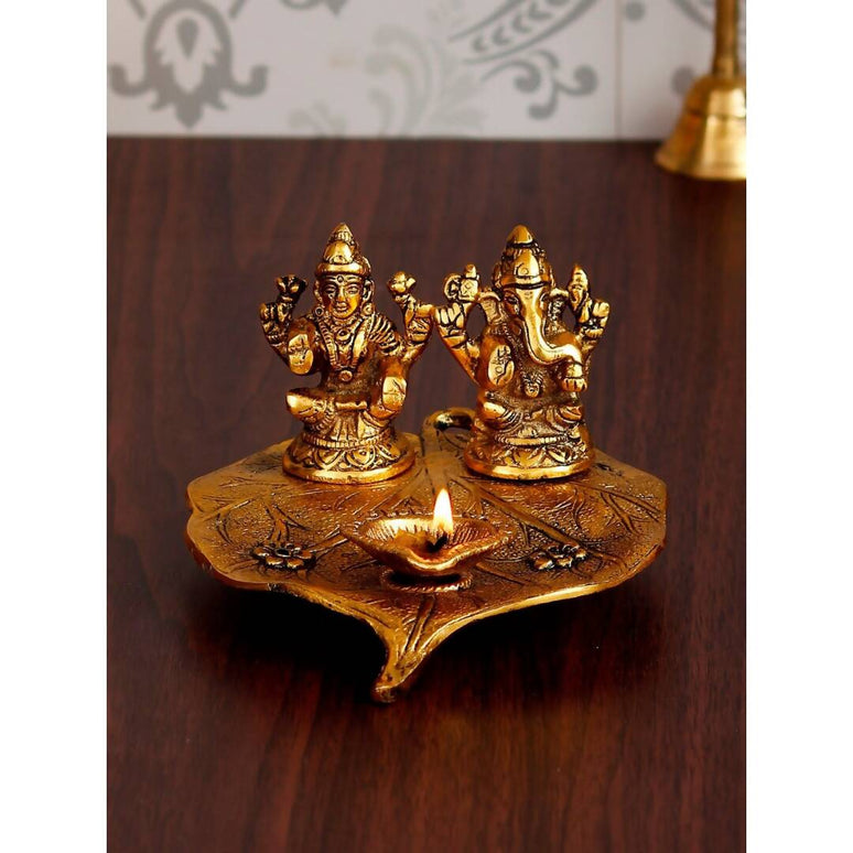 eCraftIndia Antique Gold-Toned Metal Handcrafted Laxmi Ganesh With Diya On Leaf