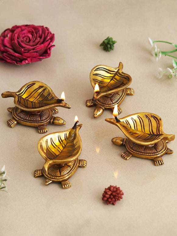 eCraftIndia 4 Pieces Beige Tortoise Statue Leaf Design Diyas