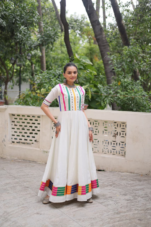 Prazu Fashion White Roman Silk Multicolor Thread And Mirror Work Navratri Gown