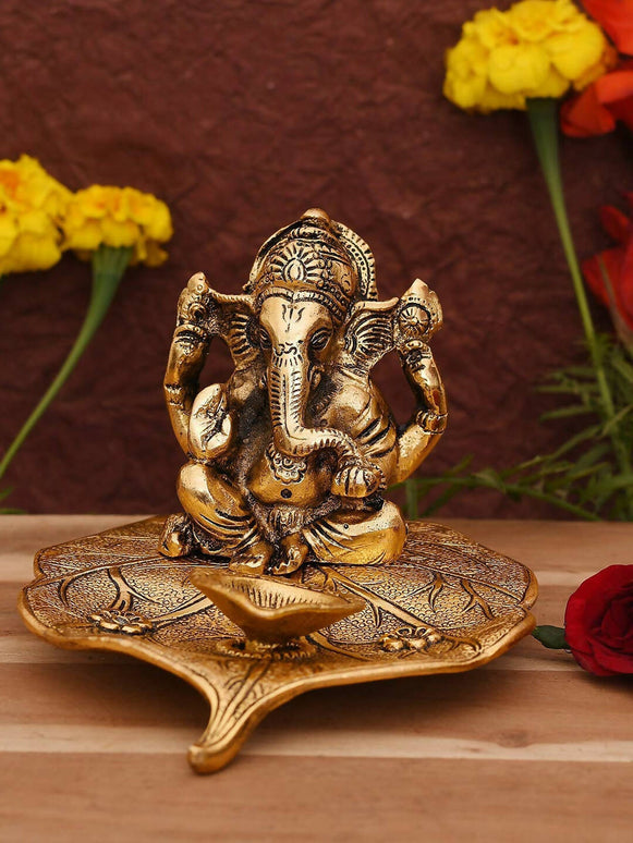 CraftVatika Gold Toned Aluminium Ganesh with Diya Idol