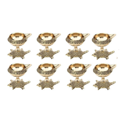 Tied Ribbons Gold Toned 8 Pieces Decorative Brass Diyas With Tortoise Base