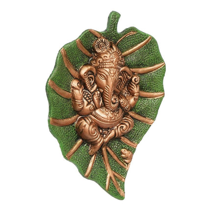 eCraftIndia Metal Golden Lord Ganesha On Green Leaf Wall Hanging Sculpture