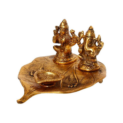 eCraftIndia Antique Gold-Toned Metal Handcrafted Laxmi Ganesh With Diya On Leaf